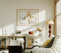 Hercules constellation star map figure print in an oak frame above a mid-century book console with a vintage radio