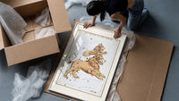 Leo Major and Leo Minor constellations framed print being unpacked from protective bubble wrap and a box
