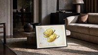 Libra constellation balance scales chart print in a slim black frame leaning on a travertine coffee table