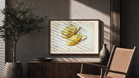 Libra constellation balance scales chart print in a wood frame above a fluted sideboard beside an olive tree