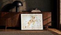 Lynx constellation celestial star chart print in a black frame leaning against a walnut console in lamplight