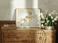 Lynx constellation celestial star chart print in an oak frame on a farmhouse dresser beside white tulips