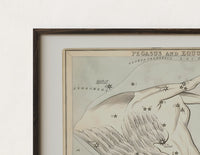 Close-up of the Winged horse Pegasus constellation map print's dark wood frame corner and archival matte paper