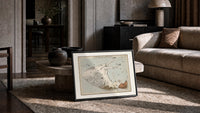 Winged horse Pegasus constellation map print in a slim black frame leaning on a travertine coffee table