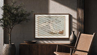 Winged horse Pegasus constellation map print in a wood frame above a fluted sideboard beside an olive tree