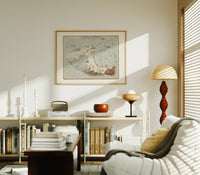 Winged horse Pegasus constellation map print in an oak frame above a mid-century book console with a vintage radio
