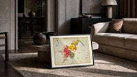 Perseus holding sword and Medusa head print in a slim black frame leaning on a travertine coffee table