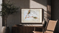 Pisces constellation with two fish print in a wood frame above a fluted sideboard beside an olive tree