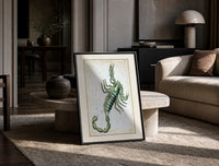 Scorpio zodiac constellation scorpion print in a black frame leaning on a travertine table in a sunlit lounge