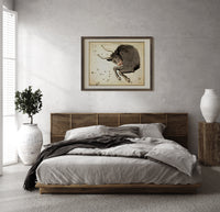 Taurus bull constellation chart print in a dark wood frame above a rattan bed on a plaster wall