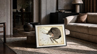 Taurus bull constellation chart print in a slim black frame leaning on a travertine coffee table