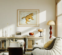 Ursa Major great bear constellation chart print in an oak frame above a mid-century book console with a vintage radio