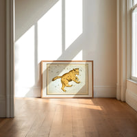 Ursa Major great bear constellation chart print in an oak frame on a sunlit wood floor beneath tall window light