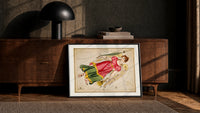 Virgo constellation maiden with wheat print in a black frame leaning against a walnut console in lamplight