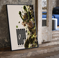 Usopp aiming slingshot in action print in a black frame leaning beside a vintage door on parquet