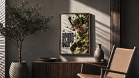 Usopp aiming slingshot in action poster framed above a fluted sideboard beside an olive tree