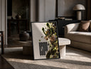 Usopp aiming slingshot in action print in a black frame leaning on a travertine table in a sunlit lounge