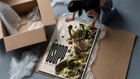 Usopp aiming slingshot in action framed print being unpacked from protective bubble wrap and a box