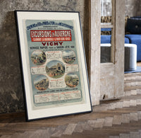 French railway travel timetable poster print in a black frame leaning beside a vintage door on parquet
