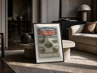 French railway travel timetable poster print in a black frame leaning on a travertine table in a sunlit lounge