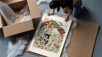 Elegant woman with red parasol and children framed print being unpacked from protective bubble wrap and a box