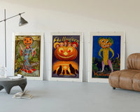 Vintage Halloween pumpkin-headed figures three-panel set displayed beside a brown leather sofa