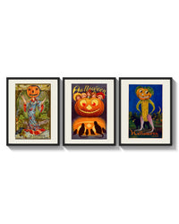 Vintage Halloween pumpkin-headed figures triptych arranged on a bright gallery wall