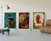 Vintage Halloween witches and black cats three-panel set displayed beside a brown leather sofa
