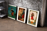 Vintage Halloween witches and black cats set of three black-framed prints leaning against a raw-plaster wall