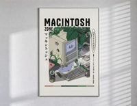 Vintage Macintosh computer with plants poster in a slim frame on a bright wall with soft window light