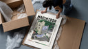 Vintage Macintosh computer with plants framed print being unpacked from protective bubble wrap and a box