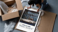 White convertible car with elegant couples framed print being unpacked from protective bubble wrap and a box