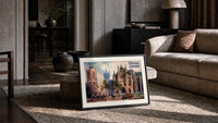 Westminster Abbey and St Margaret's Church print in a slim black frame leaning on a travertine coffee table