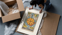 Wheel of Fortune tarot card framed print being unpacked from protective bubble wrap and a box