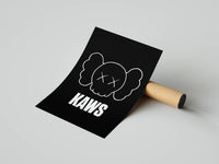 White outline KAWS skull head paired with bold white KAWS lettering on solid black background art print from a tube