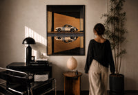 White 911 Hangar Sunset Reflection print in a black frame on a sunlit wall with a viewer