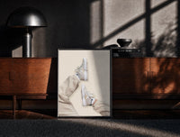 Black-framed White Sneakers with Cream Trousers print on the floor in front of a dark wooden console