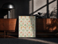 Black-framed Vintage floral pattern with daisies print on a moody console with designer coffee-table books