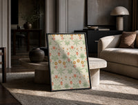 Vintage floral pattern with daisies print in a black frame leaning on a travertine table in a sunlit lounge