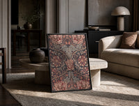 Ornate floral honeysuckle pattern print in a black frame leaning on a travertine table in a sunlit lounge