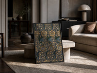 Ornate floral vine pattern print in a black frame leaning on a travertine table in a sunlit lounge