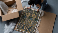 Ornate floral vine pattern framed print being unpacked from protective bubble wrap and a box
