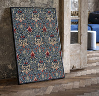 Victorian floral damask pattern print in a black frame leaning beside a vintage door on parquet