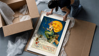 Witch riding broomstick past moon framed print being unpacked from protective bubble wrap and a box