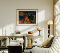 Witch flying on broomstick with pumpkin print in an oak frame above a mid-century book console with a vintage radio