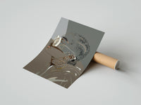 Gently curled Woman in Heart Hoops and Sunglasses print beside its protective shipping tube