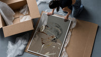 Woman in Heart Hoops and Sunglasses framed print being unpacked from protective bubble wrap and a box
