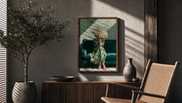 Woman with a Fan in Green Stripes poster framed above a fluted sideboard beside a potted tree