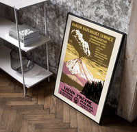 Erupting volcano over lake poster in a black frame leaning beside a shelf in a raw-plaster loft