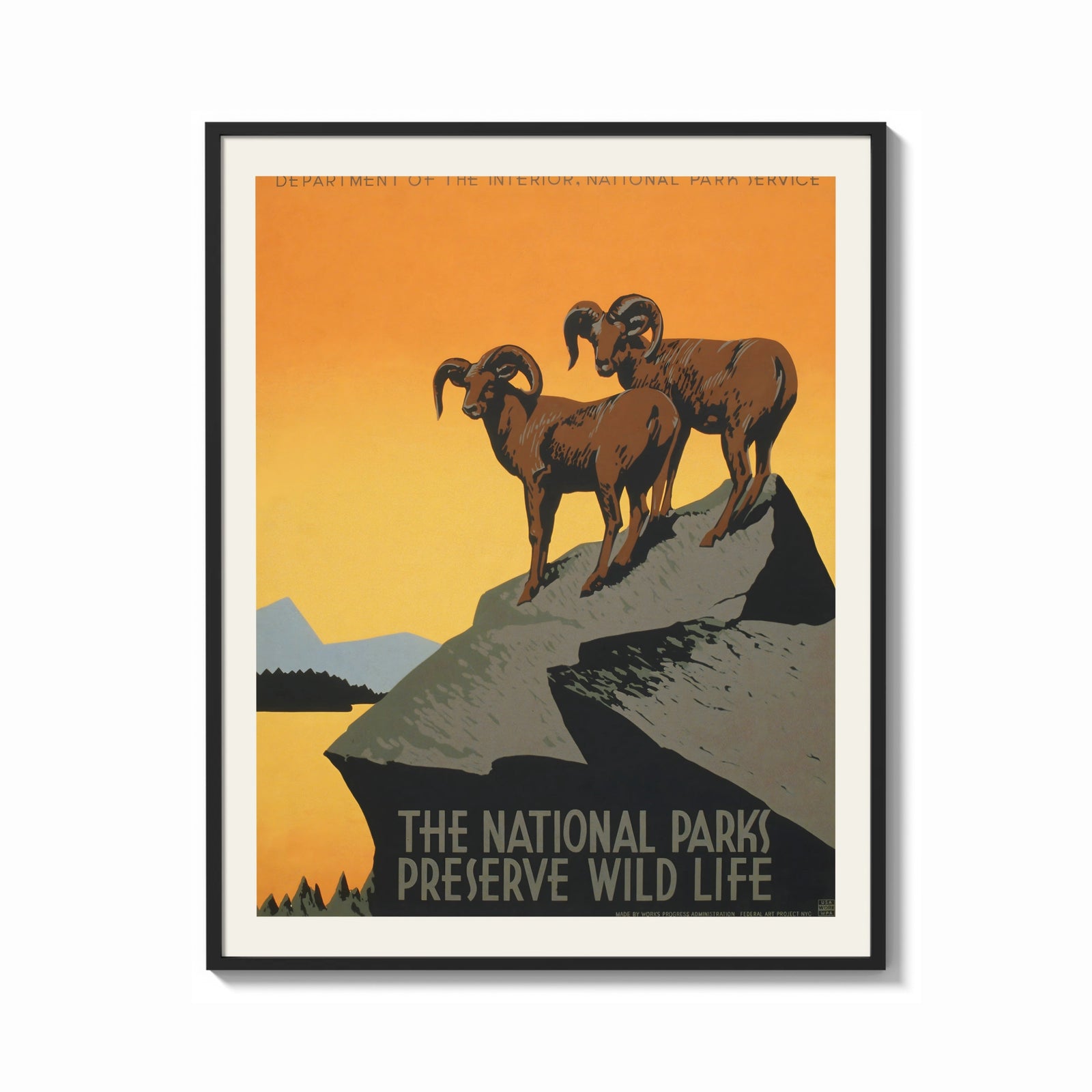 Framed Two bighorn sheep on rocky cliff print shown as a bold statement piece on a clean gallery wall